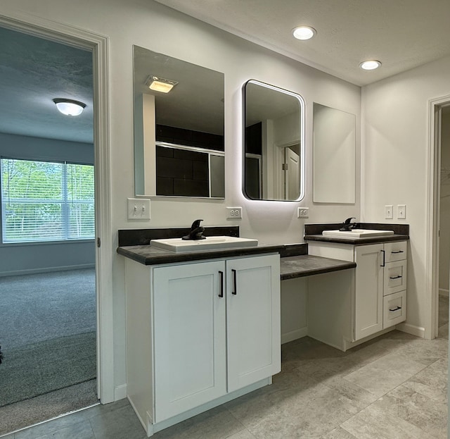 2827 Green Acres Dr, Mulliken, MI 48861 - bathroom featuring double vanity, baseboards, and recessed lighting