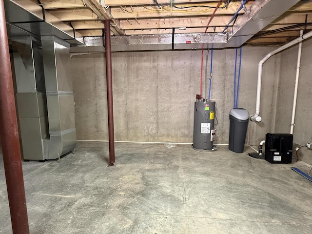 2827 Green Acres Dr, Mulliken, MI 48861 - unfinished below grade area with electric water heater and a water softener system