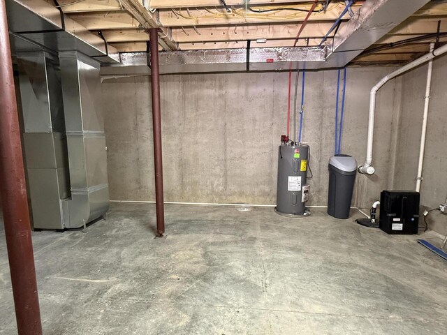2827 Green Acres Dr, Mulliken, MI 48861 - unfinished below grade area with electric water heater and a water softener system