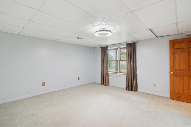 1750 Fox Rd, Jackson, MI 49201 - empty room featuring a drop ceiling, carpet flooring, and baseboards