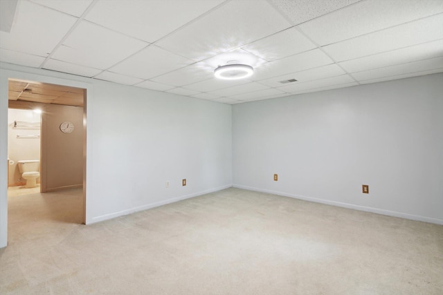 1750 Fox Rd, Jackson, MI 49201 - unfurnished room featuring a paneled ceiling, light carpet, and baseboards