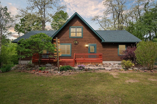 1750 Fox Rd, Jackson, MI 49201 - back of property with roof with shingles, a wooden deck, and a lawn