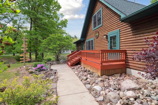 1750 Fox Rd, Jackson, MI 49201 - view of side of home with a wooden deck and roof with shingles