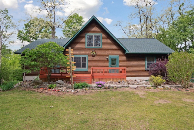 1750 Fox Rd, Jackson, MI 49201 - rear view of house featuring a deck, a shingled roof, a yard, and log siding