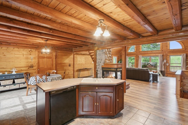 1750 Fox Rd, Jackson, MI 49201 - kitchen with black dishwasher, open floor plan, a chandelier, a sink, and wood ceiling with exposed beams