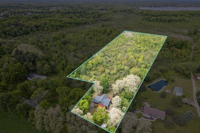 1750 Fox Rd, Jackson, MI 49201 - aerial view of property and surrounding area featuring a heavily wooded area and property boundaries highlighted
