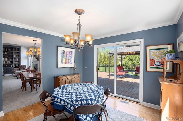 5200 Bridge Trl W, Commerce Twp, MI 48382 - dining space with a chandelier, crown molding, light wood-type flooring, and baseboards