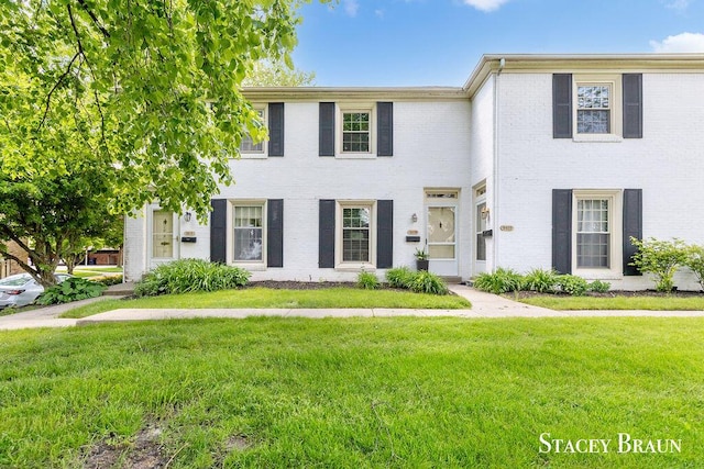 2420 Abbington Dr SE Unit 40, Grand Rapids, MI 49506 - townhome / multi-family property featuring a front yard and brick siding