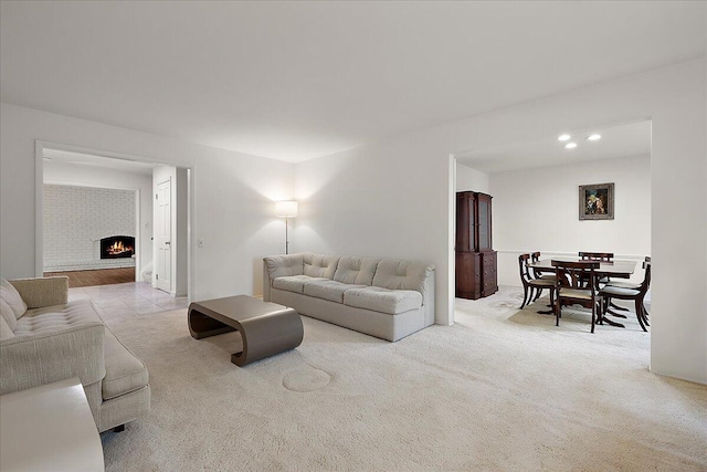 4948 Hardwoods Dr, West Bloomfield, MI 48323 - carpeted living room featuring a brick fireplace and recessed lighting