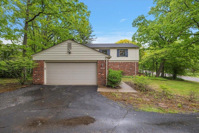 4948 Hardwoods Dr, West Bloomfield, MI 48323 - view of front facade with brick siding, asphalt driveway, and a garage