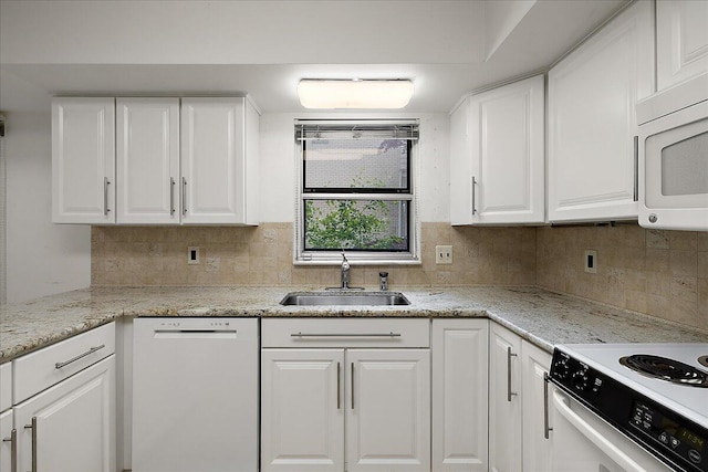 4948 Hardwoods Dr, West Bloomfield, MI 48323 - kitchen with white appliances, a sink, white cabinetry, and tasteful backsplash