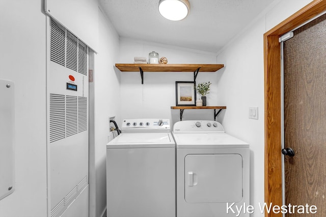 206 Pearl St, Sheridan, MI 48884 - laundry room with washer and dryer, a heating unit, and crown molding