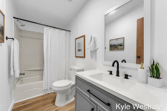 206 Pearl St, Sheridan, MI 48884 - bathroom featuring toilet, vanity, wood finished floors, and shower / bath combination with curtain