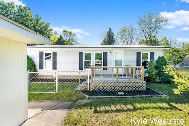 206 Pearl St, Sheridan, MI 48884 - view of front facade featuring a deck and metal roof