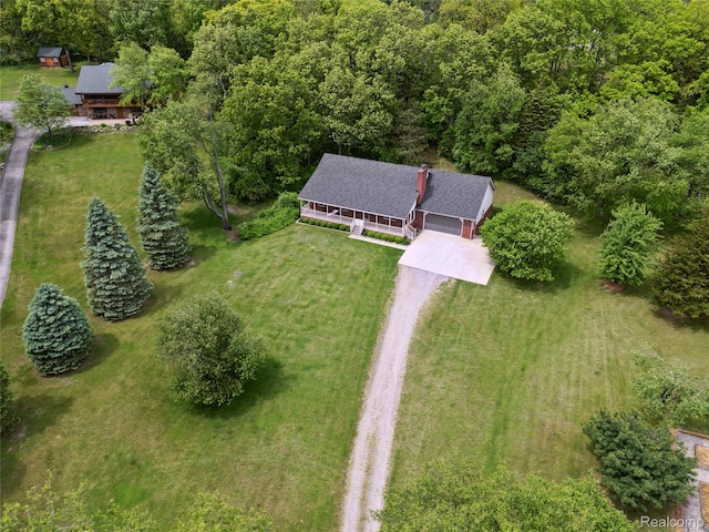 1330 Evergreen, Milford, MI 48380 - aerial view of property and surrounding area with a heavily wooded area