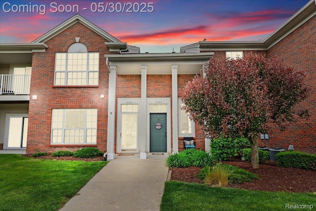 51623 Hale Ln, Chesterfield, MI 48051 - entrance to property with brick siding, a lawn, and central AC