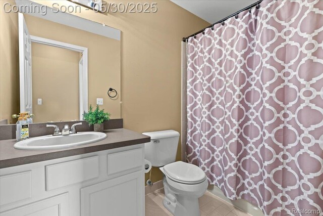 51623 Hale Ln, Chesterfield, MI 48051 - full bath featuring toilet, vanity, tile patterned flooring, and a shower with shower curtain