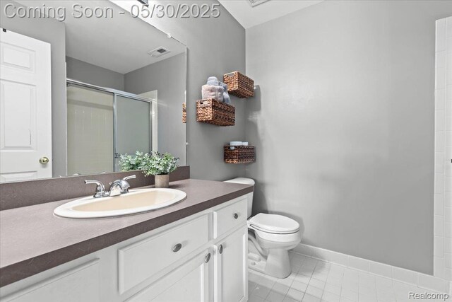 51623 Hale Ln, Chesterfield, MI 48051 - full bath featuring toilet, vanity, a stall shower, tile patterned flooring, and baseboards