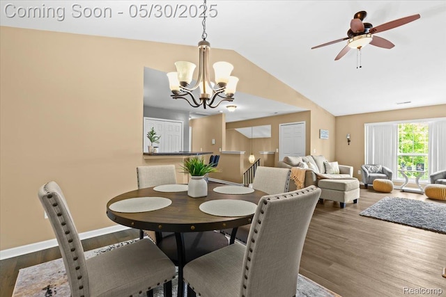 51623 Hale Ln, Chesterfield, MI 48051 - dining room with a chandelier, lofted ceiling, wood finished floors, a ceiling fan, and baseboards