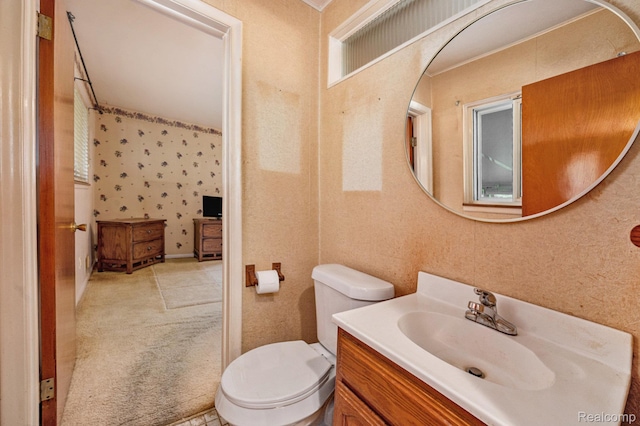 6439 Rockdale Ct, Dearborn Heights, MI 48127 - bathroom with vanity, toilet, and wallpapered walls