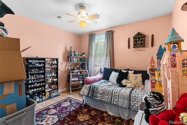 306 Hamilton St, Byron, MI 48418 - bedroom featuring wood finished floors and a ceiling fan