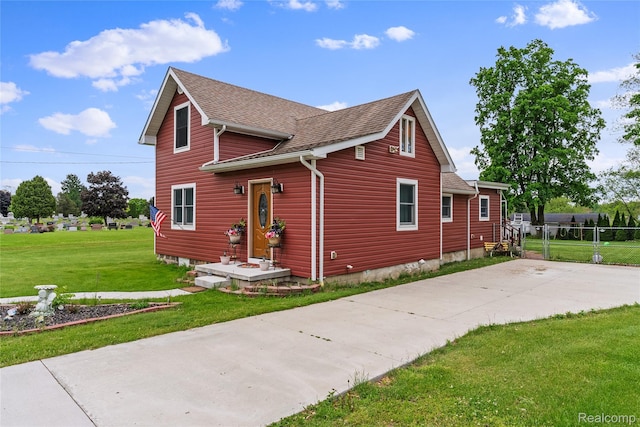 306 Hamilton St, Byron, MI 48418 - view of side of home featuring a shingled roof and driveway