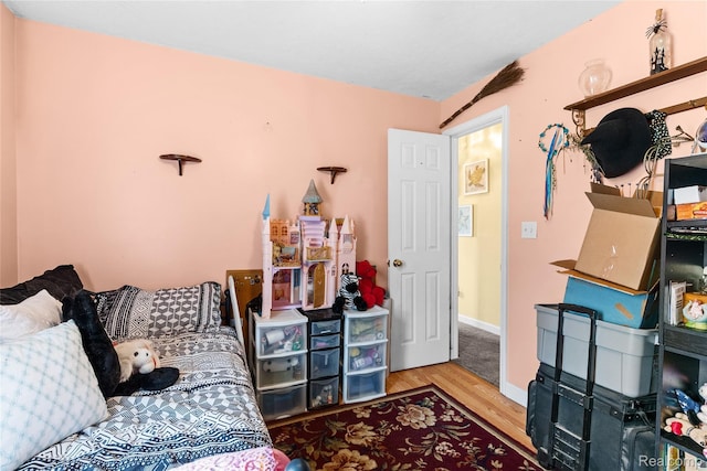 306 Hamilton St, Byron, MI 48418 - bedroom featuring wood finished floors and baseboards