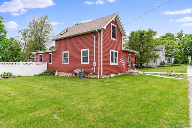 306 Hamilton St, Byron, MI 48418 - view of side of property with cooling unit and roof with shingles