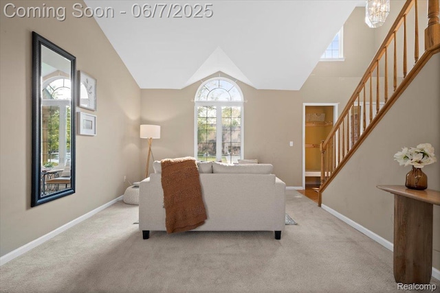 5602 Adderstone Dr, Clarkston, MI 48346 - living area with stairway, light carpet, baseboards, and vaulted ceiling