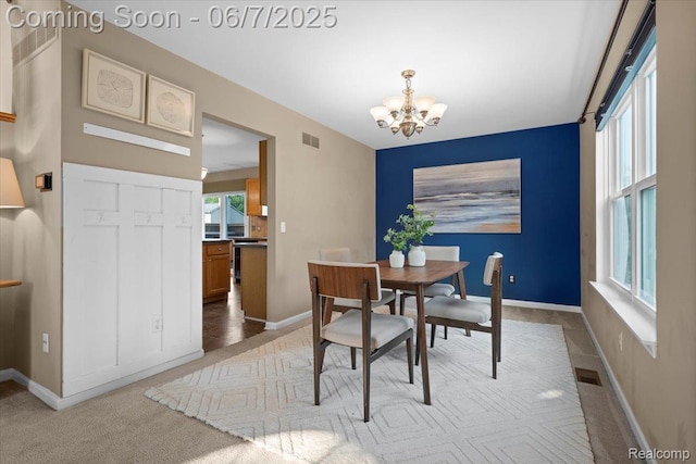 5602 Adderstone Dr, Clarkston, MI 48346 - dining room with a chandelier, light carpet, and baseboards