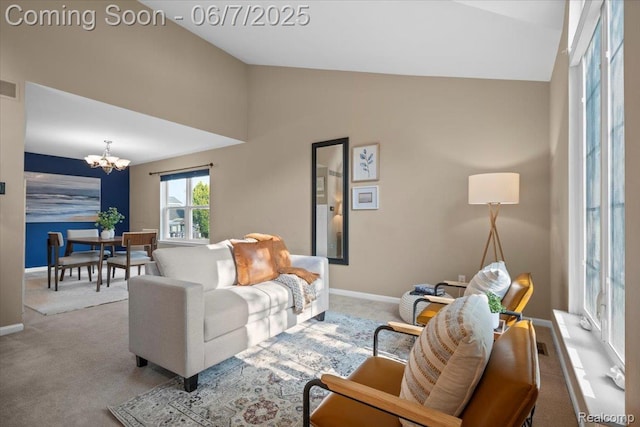5602 Adderstone Dr, Clarkston, MI 48346 - carpeted living area featuring vaulted ceiling, a chandelier, and baseboards