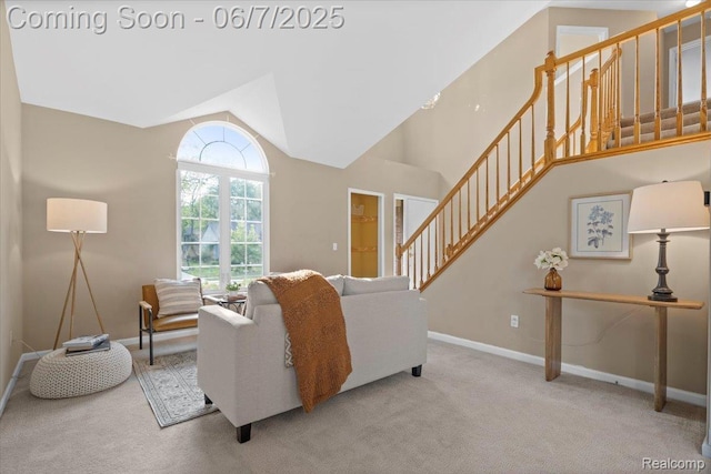 5602 Adderstone Dr, Clarkston, MI 48346 - carpeted living room with stairs, baseboards, and lofted ceiling