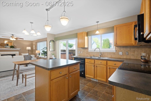 5602 Adderstone Dr, Clarkston, MI 48346 - kitchen featuring black appliances, dark countertops, a sink, and tasteful backsplash