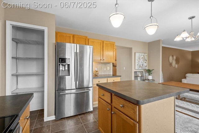 5602 Adderstone Dr, Clarkston, MI 48346 - kitchen with appliances with stainless steel finishes, dark countertops, tasteful backsplash, dark tile patterned flooring, and hanging light fixtures