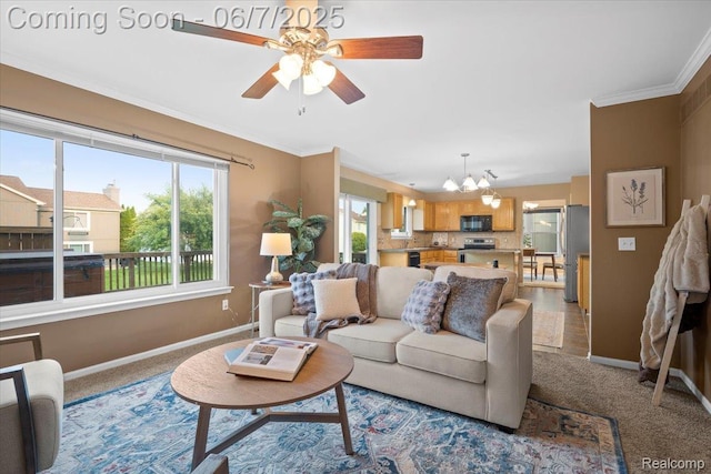 5602 Adderstone Dr, Clarkston, MI 48346 - carpeted living room featuring baseboards, healthy amount of natural light, a chandelier, a ceiling fan, and crown molding
