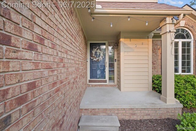 5602 Adderstone Dr, Clarkston, MI 48346 - doorway to property with brick siding, a porch, and roof with shingles