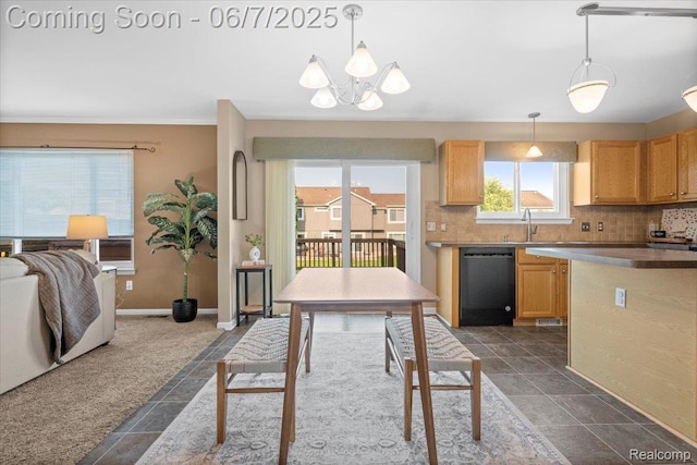 5602 Adderstone Dr, Clarkston, MI 48346 - kitchen featuring dishwashing machine, backsplash, a chandelier, a sink, and baseboards