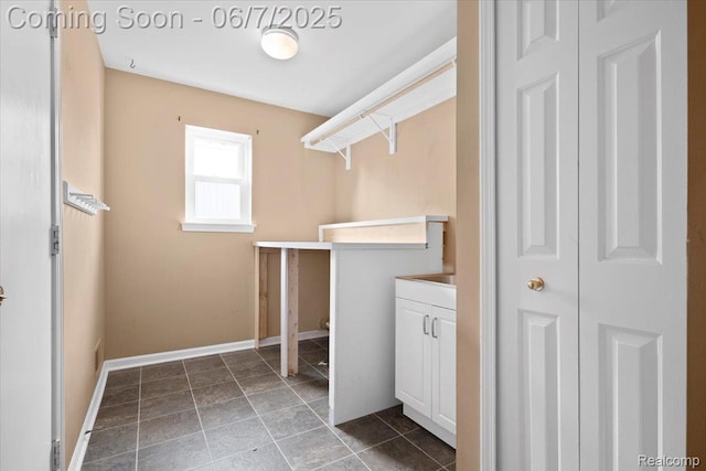 5602 Adderstone Dr, Clarkston, MI 48346 - laundry area featuring baseboards