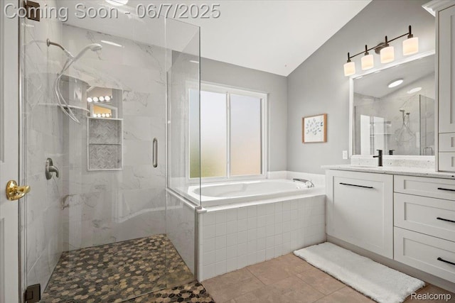 5602 Adderstone Dr, Clarkston, MI 48346 - full bathroom featuring healthy amount of natural light, a marble finish shower, vanity, a garden tub, and lofted ceiling