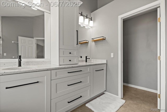 5602 Adderstone Dr, Clarkston, MI 48346 - bathroom featuring double vanity, baseboards, and tile patterned floors