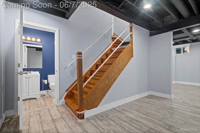5602 Adderstone Dr, Clarkston, MI 48346 - basement with wood finished floors, stairway, and baseboards