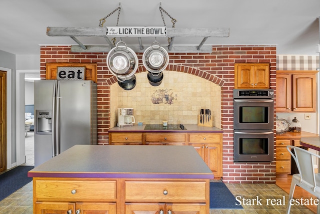 300 N 2nd Ave, Fruitport, MI 49415 - kitchen with stainless steel appliances and a center island