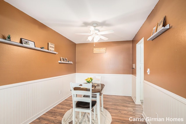 6716 Cascade Rd SE, Grand Rapids, MI 49546 - dining area featuring wainscoting, a ceiling fan, and wood finished floors