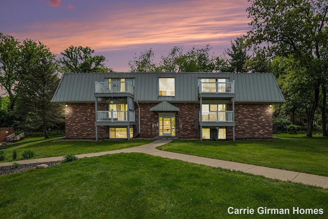 6716 Cascade Rd SE, Grand Rapids, MI 49546 - view of front of home with a balcony, brick siding, and a front yard