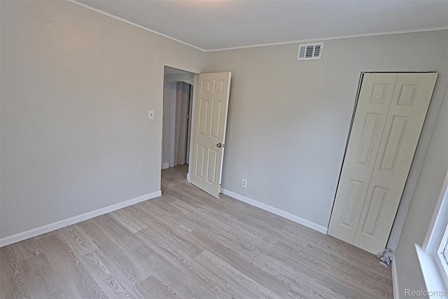19444 Inkster Rd, Redford, MI 48240 - spare room featuring light wood finished floors, ornamental molding, and baseboards