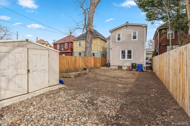 2547 Seyburn St, Detroit, MI 48214 - rear view of house with a fenced backyard and a residential view