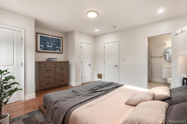 2547 Seyburn St, Detroit, MI 48214 - bedroom with wood finished floors, recessed lighting, baseboards, and connected bathroom