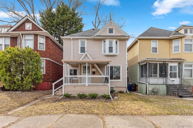 2547 Seyburn St, Detroit, MI 48214 - traditional style home with a porch and a sunroom