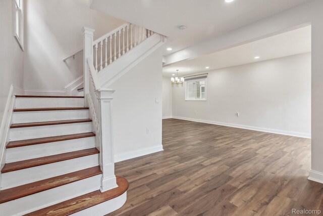 2547 Seyburn St, Detroit, MI 48214 - stairs featuring wood finished floors, recessed lighting, a chandelier, and baseboards