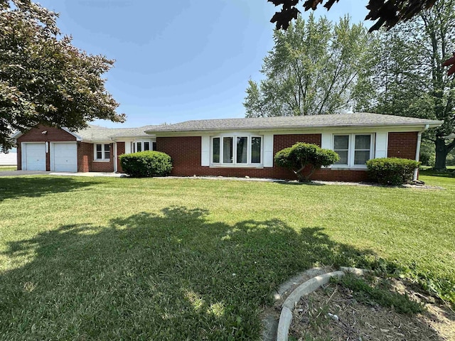 13405 S Gera Rd, Birch Run, MI 48415 - ranch-style house featuring brick siding, a front yard, and a garage